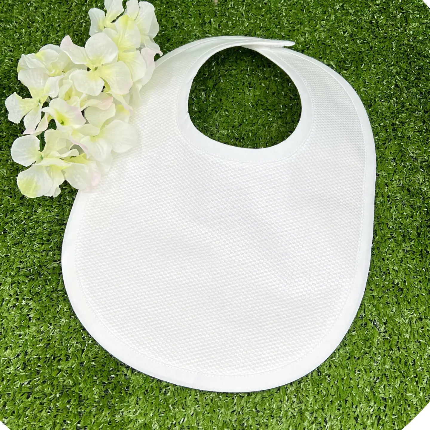 Cotton pique/white baby bib