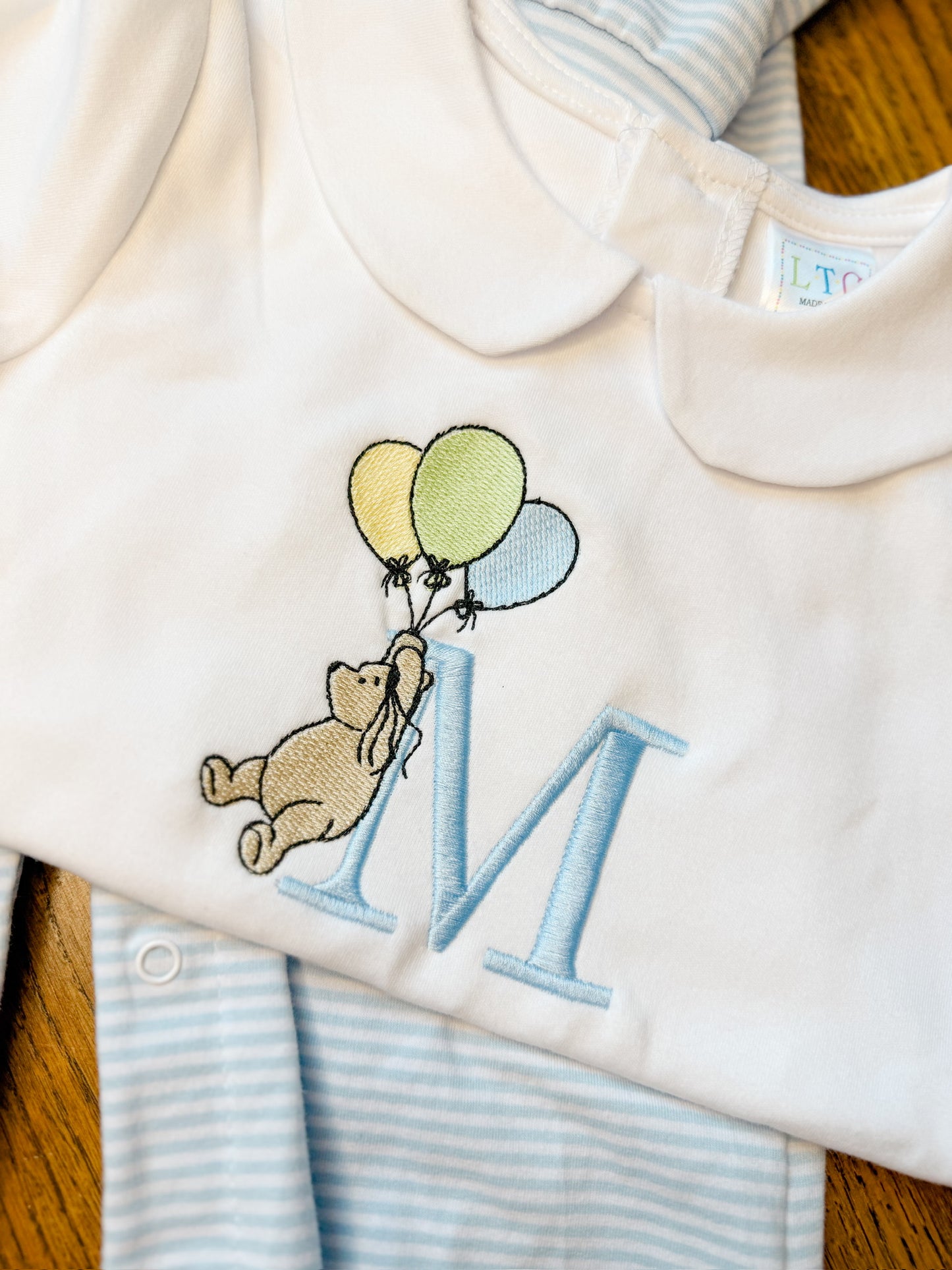 Storybook bear with balloons