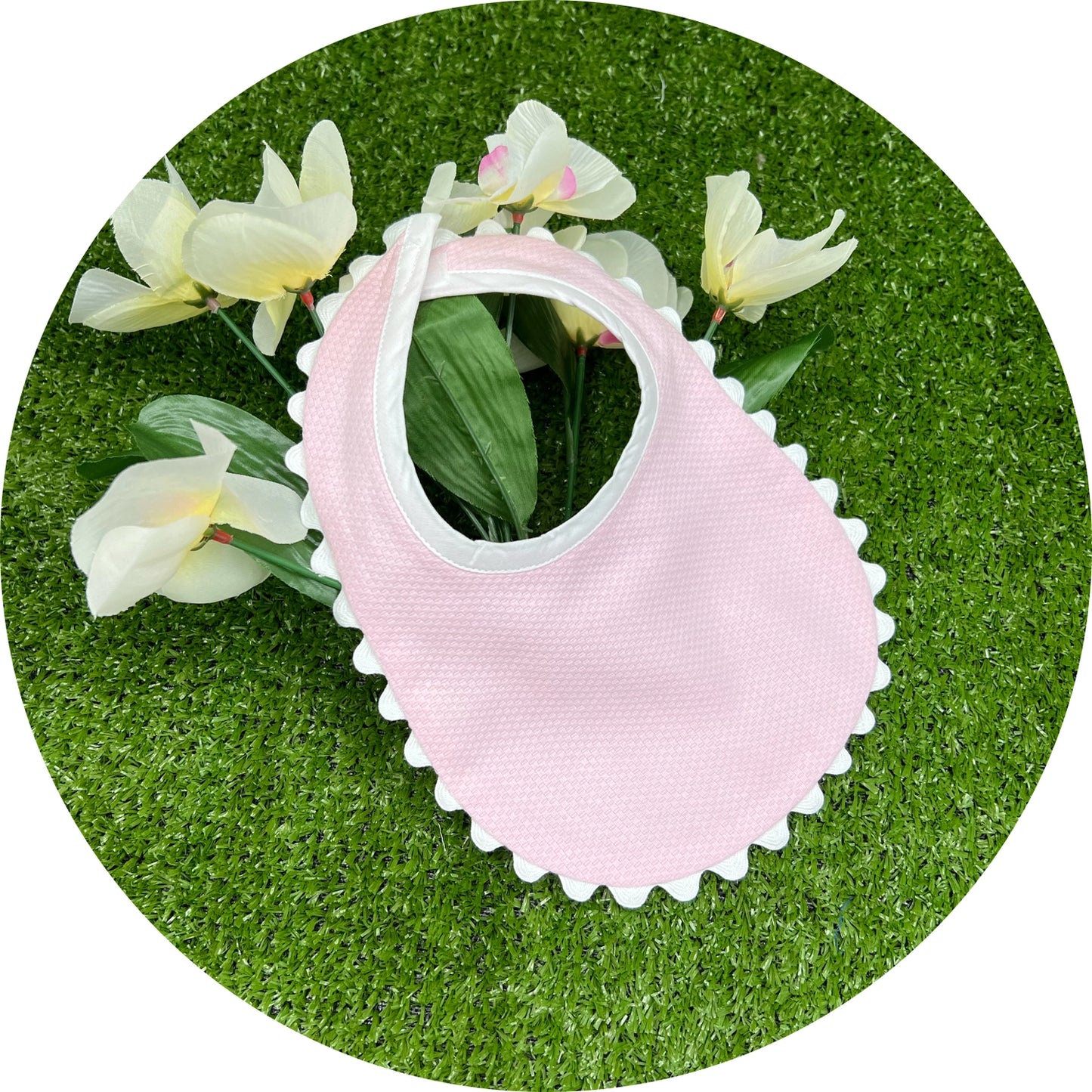 Cotton pique, pink, white trim infant bib
