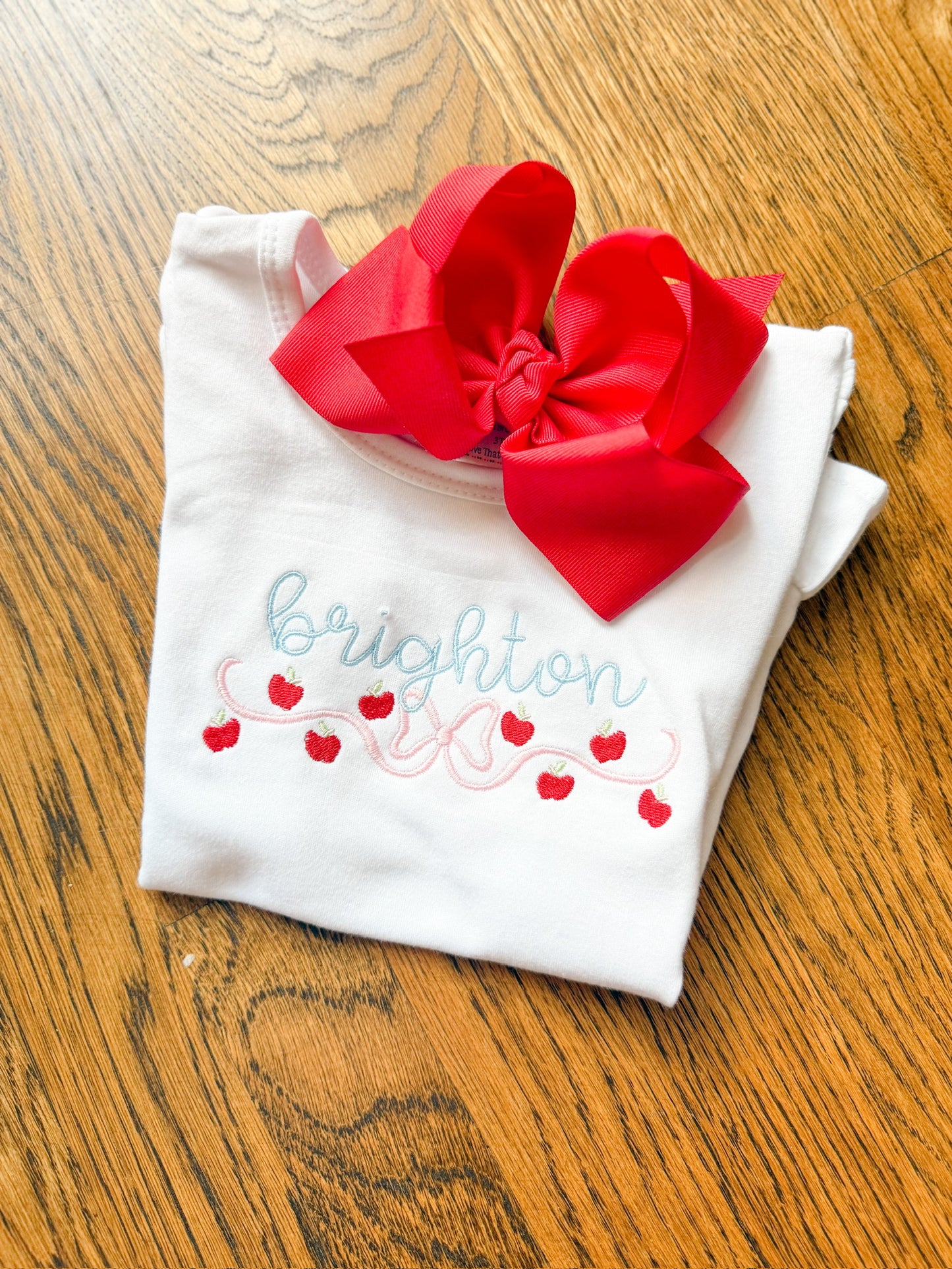 tumbling apple with bow