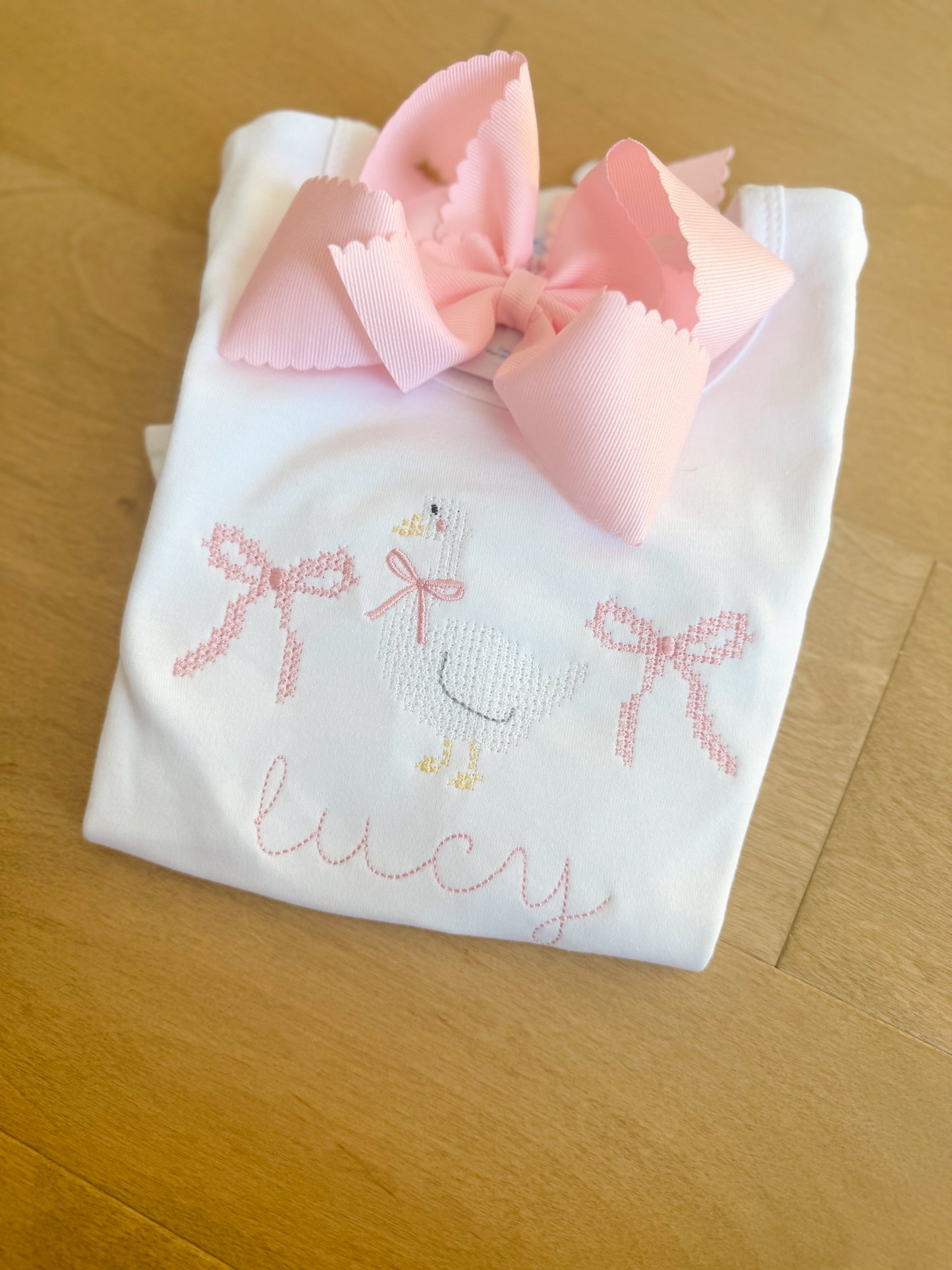 cross-stitch goose and bows
