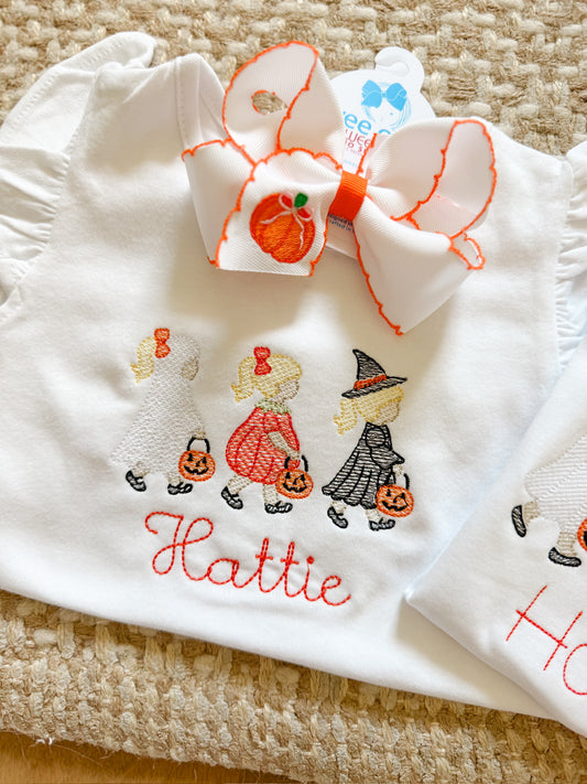 Little trick-or-treat trio girl