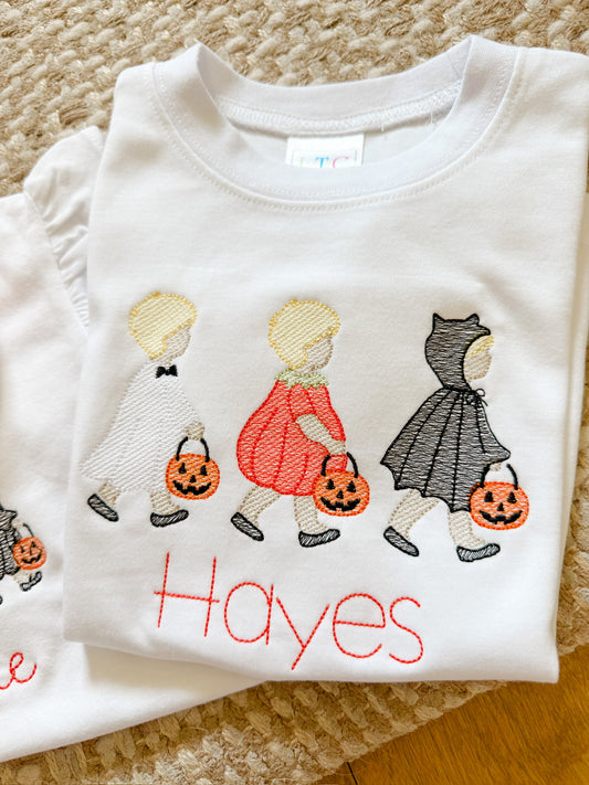 Little trick-or-treat trio boy